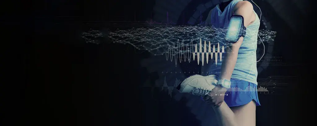 a woman wearing tennis shoes and a digital exercise armband